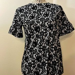 MICHAEL KORS black and white tee shirt.